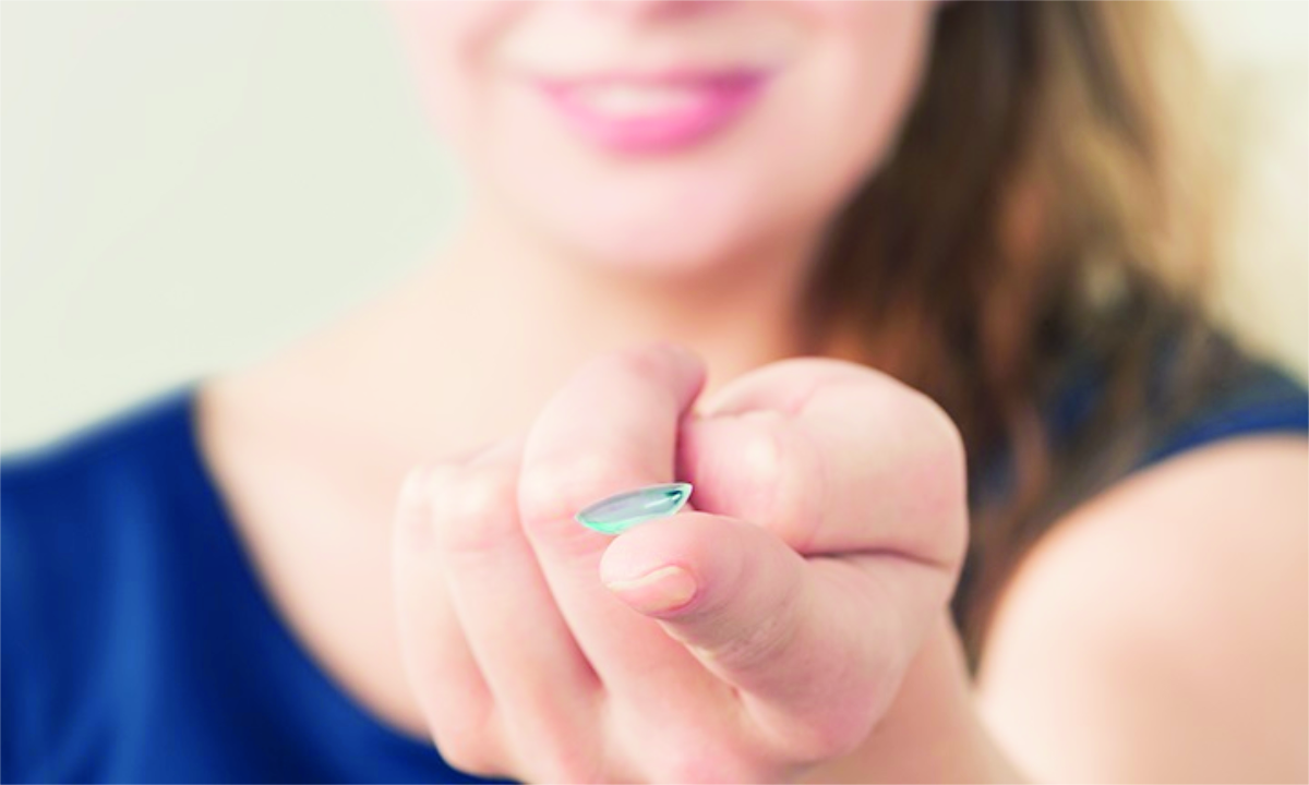 woman with contact lens